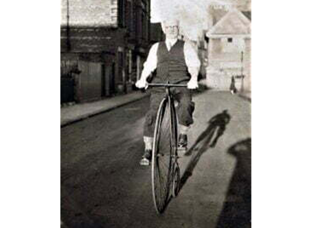 Joseph Armstrong riding a penny farthing bicycle